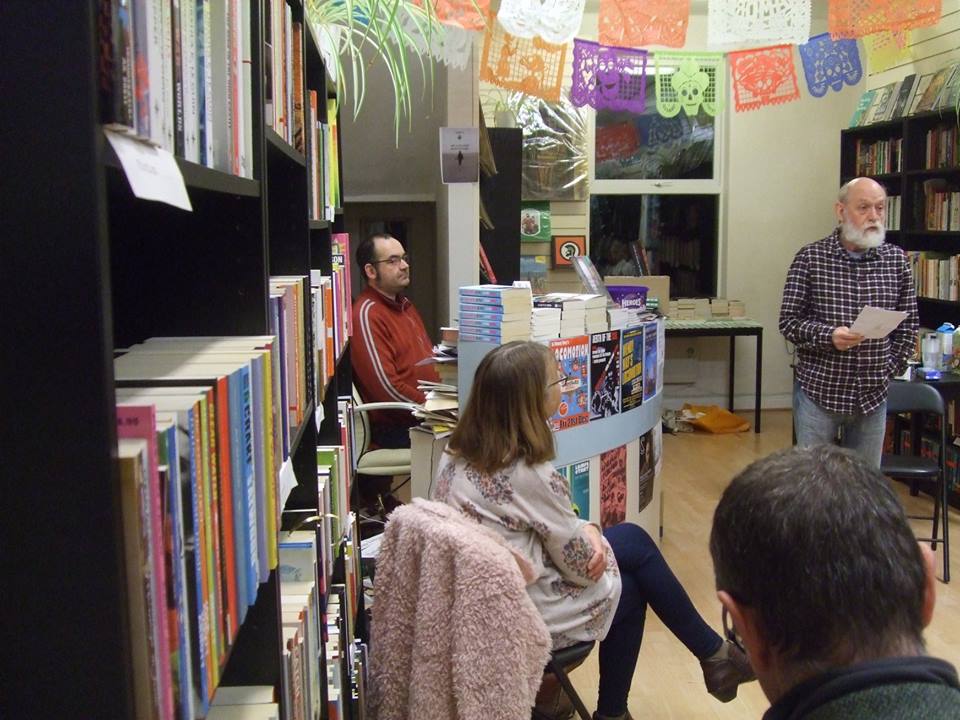 Printed Matter owner Lee listens to Brian Docherty's 100-words worth