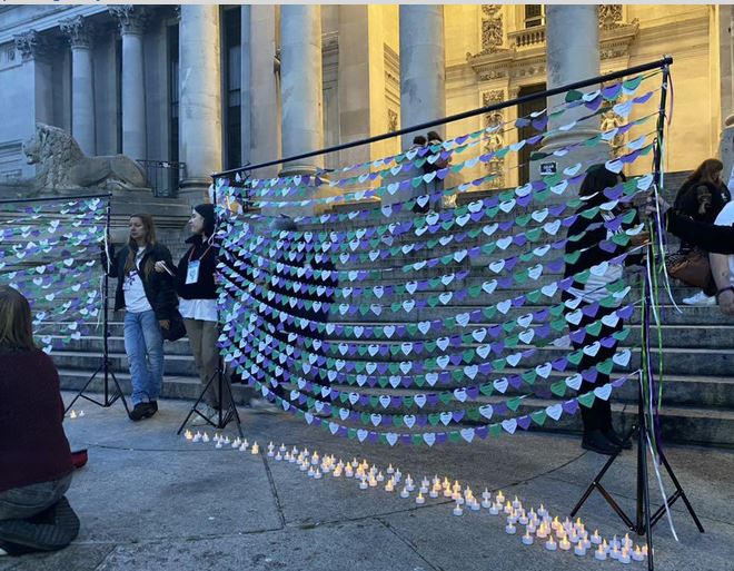 "say their names" hearts and candles for the women who died
