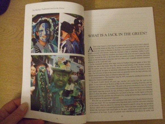 Pages of the book showing characters in the parade, and text 'what is Jack in the Green?'