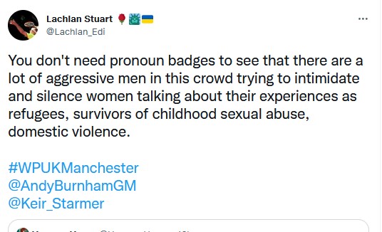 Lachlan Stuart: You don't need pronoun badges to see that there are a lot of aggressive men in this crowd trying to intimidate and silence women talking abou ttheir experiences as refugees, survivors of childhood sexual abuse, domestic violence.
