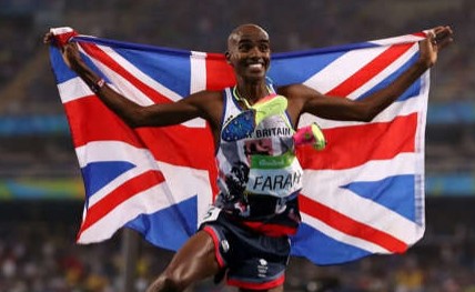 Mo Farah carrying the Union Flag in triumph at the Olympics
