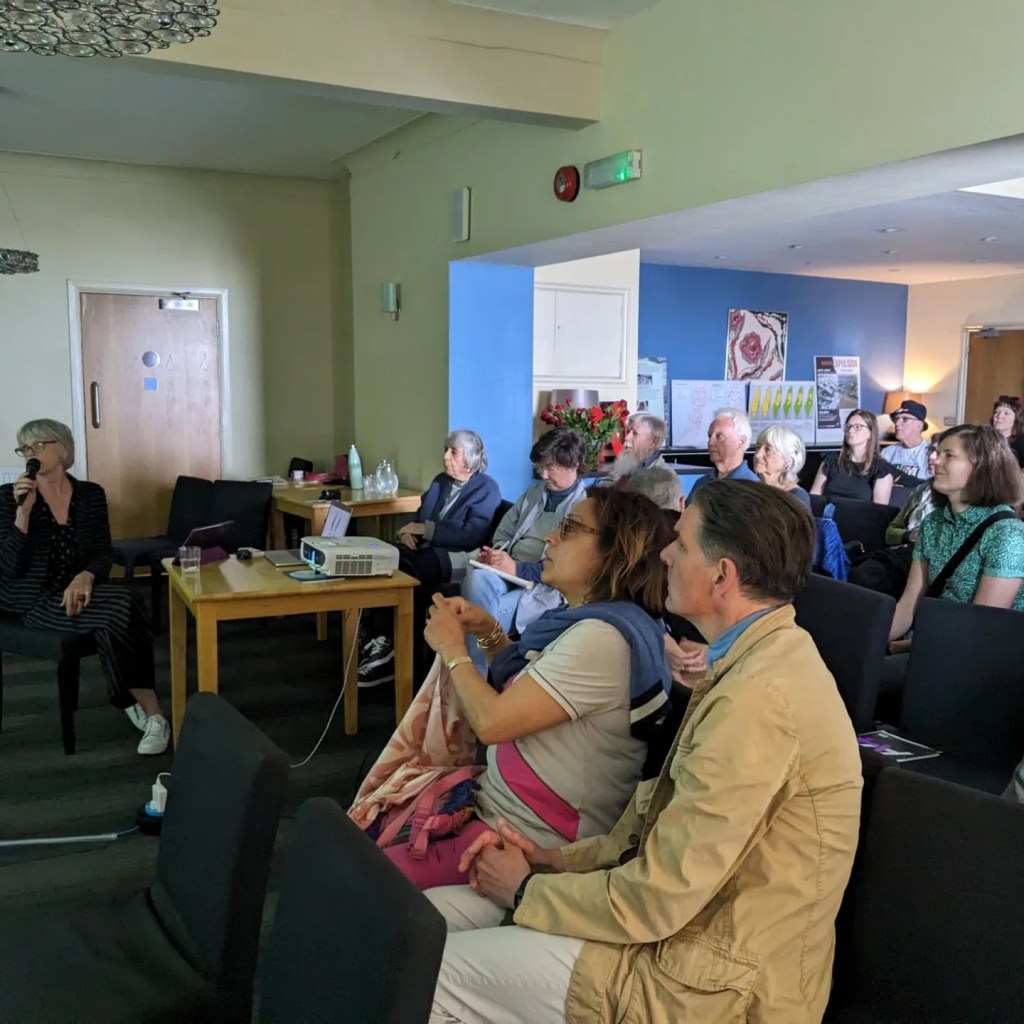 me scribbling notes in a political lecture