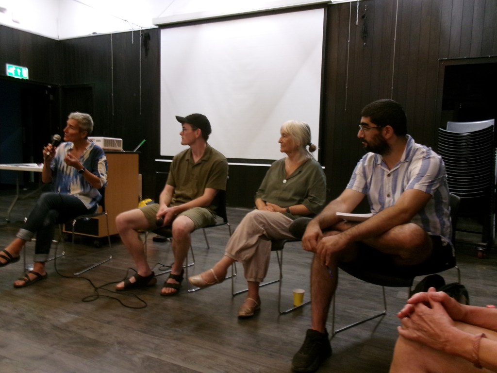 Michele Aaron with the three discussion leaders at the student encampments Q and A